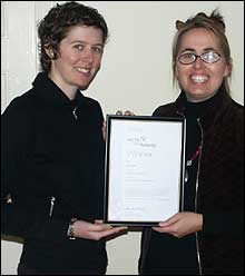 Camilla and Jane holding AGTA award